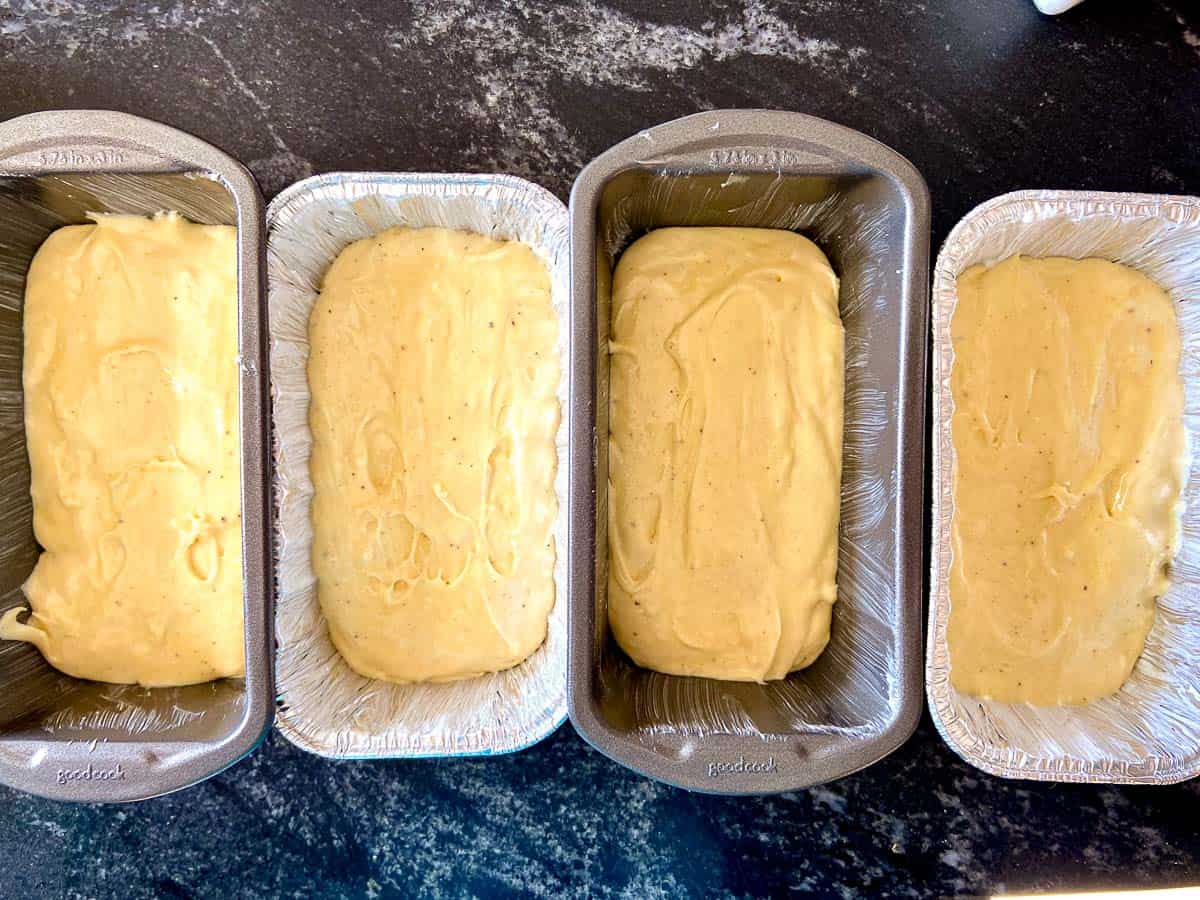 Loafpans with batter on counter