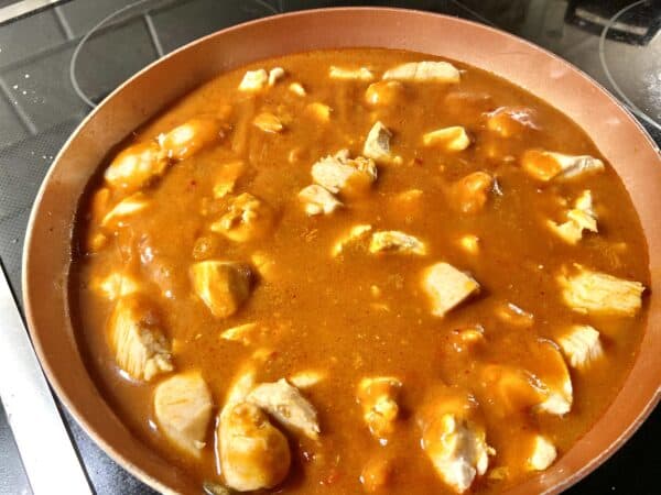 Chicken and sauce in skillet