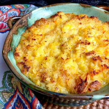 Pineapple casserole in turquoise baking dish.