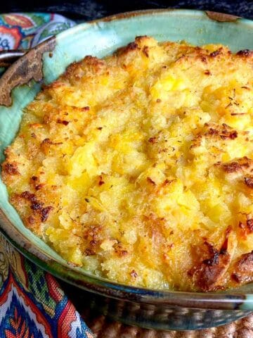 Pineapple casserole in turquoise baking dish.