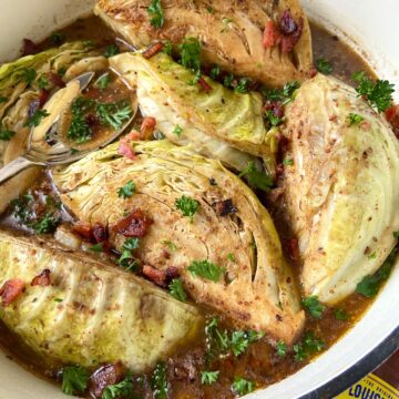 Braised cabbage in white Dutch oven.