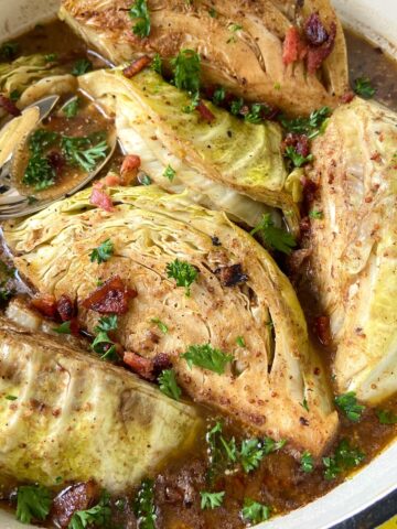 Braised cabbage in white Dutch oven.