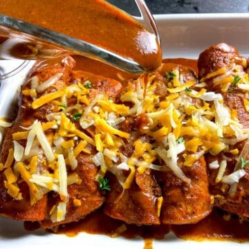 Red Enchilada sauce drizzled over enchiladas