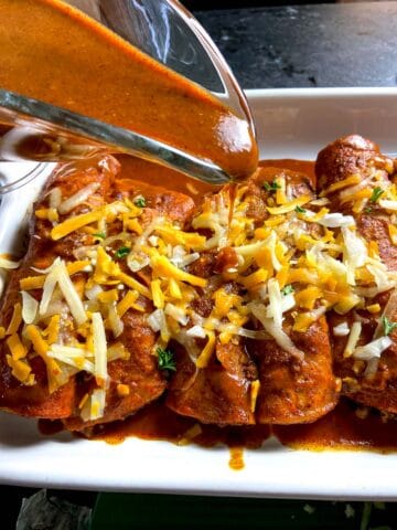 Red Enchilada sauce drizzled over enchiladas