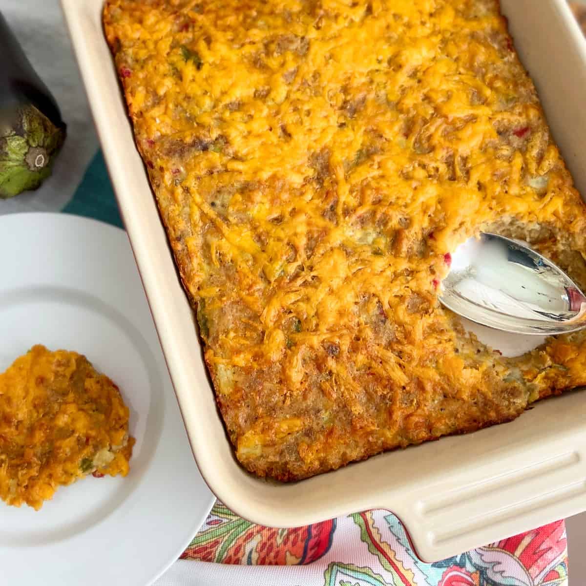 Eggplant casserole in white baking dish.