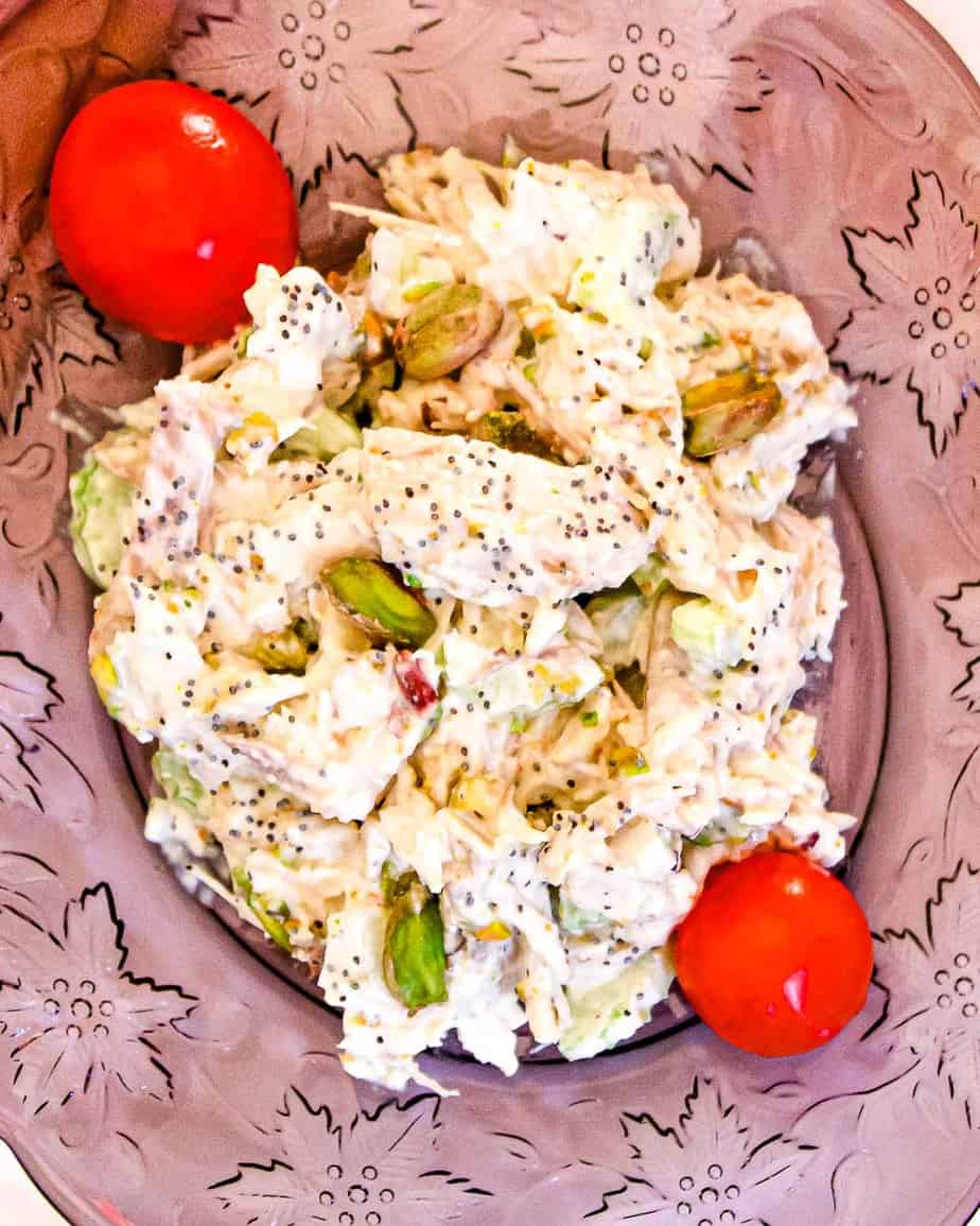 Pistachio Chicken salad on purple luncheon plate.