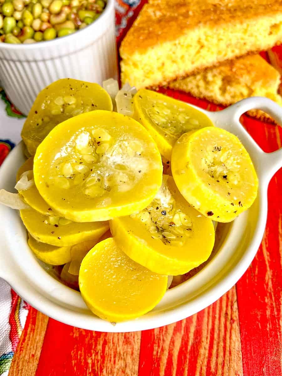 Sauteed squash in white bowl.