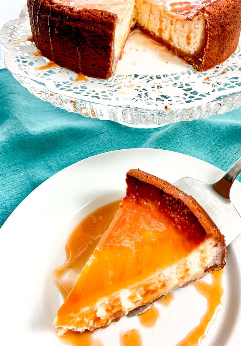 Salted caramel cheesecake on white plate.