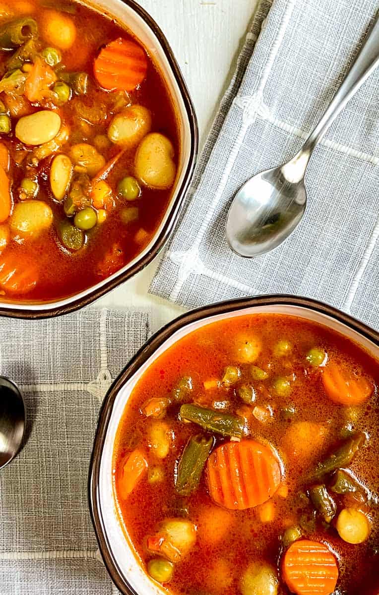 Two bowls of vegetable soup.