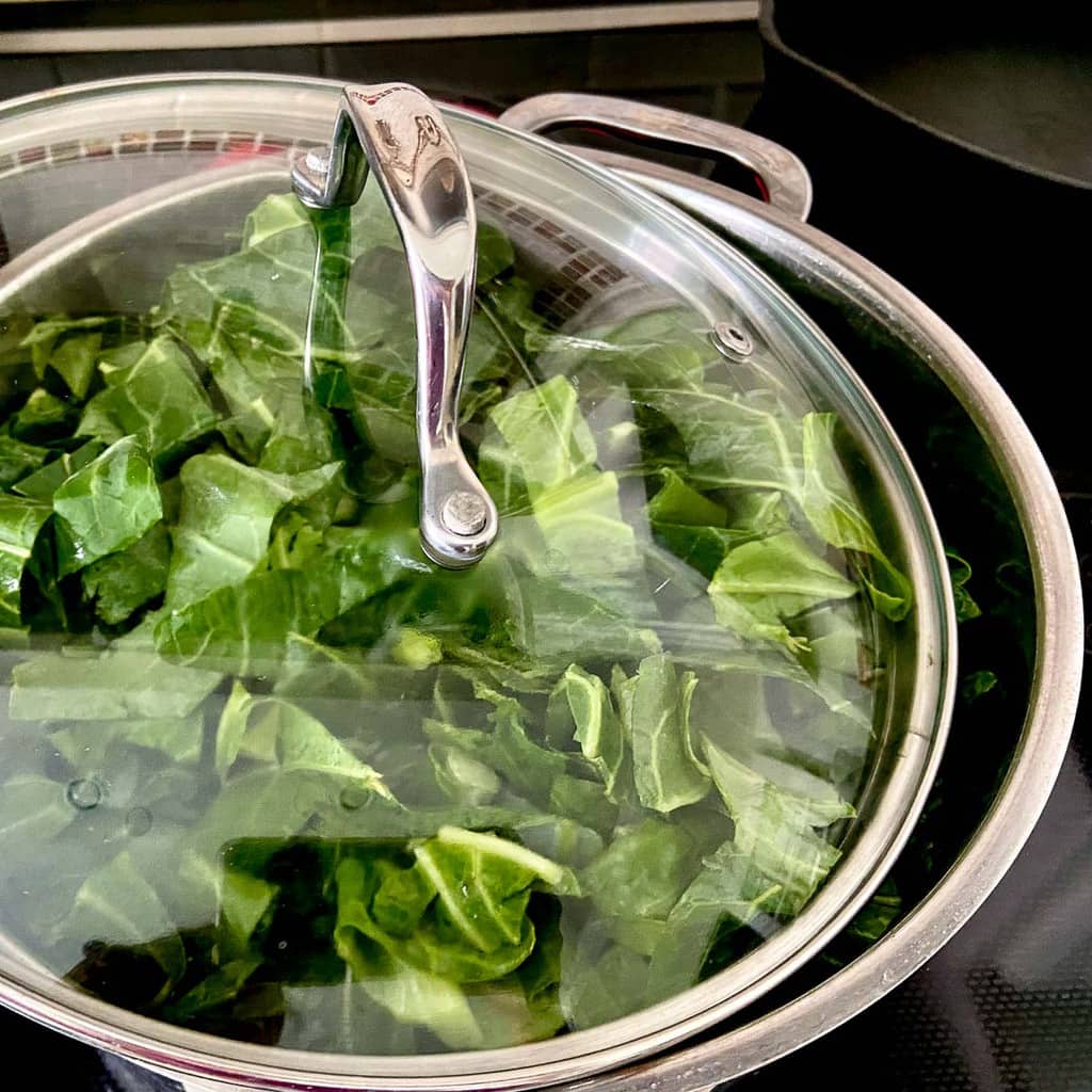 Dutch oven with glass lid ajar.