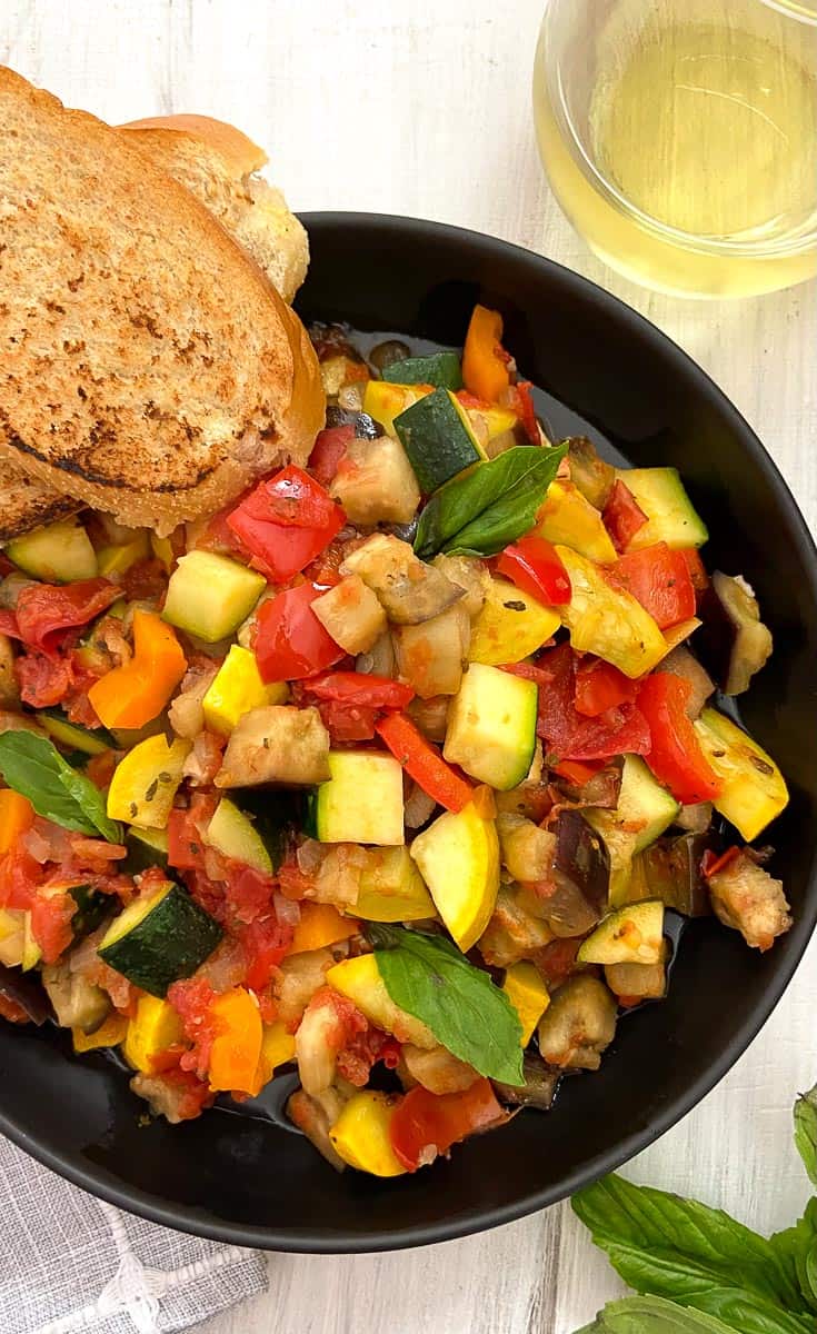 Classic French Ratatouille in black bowl.