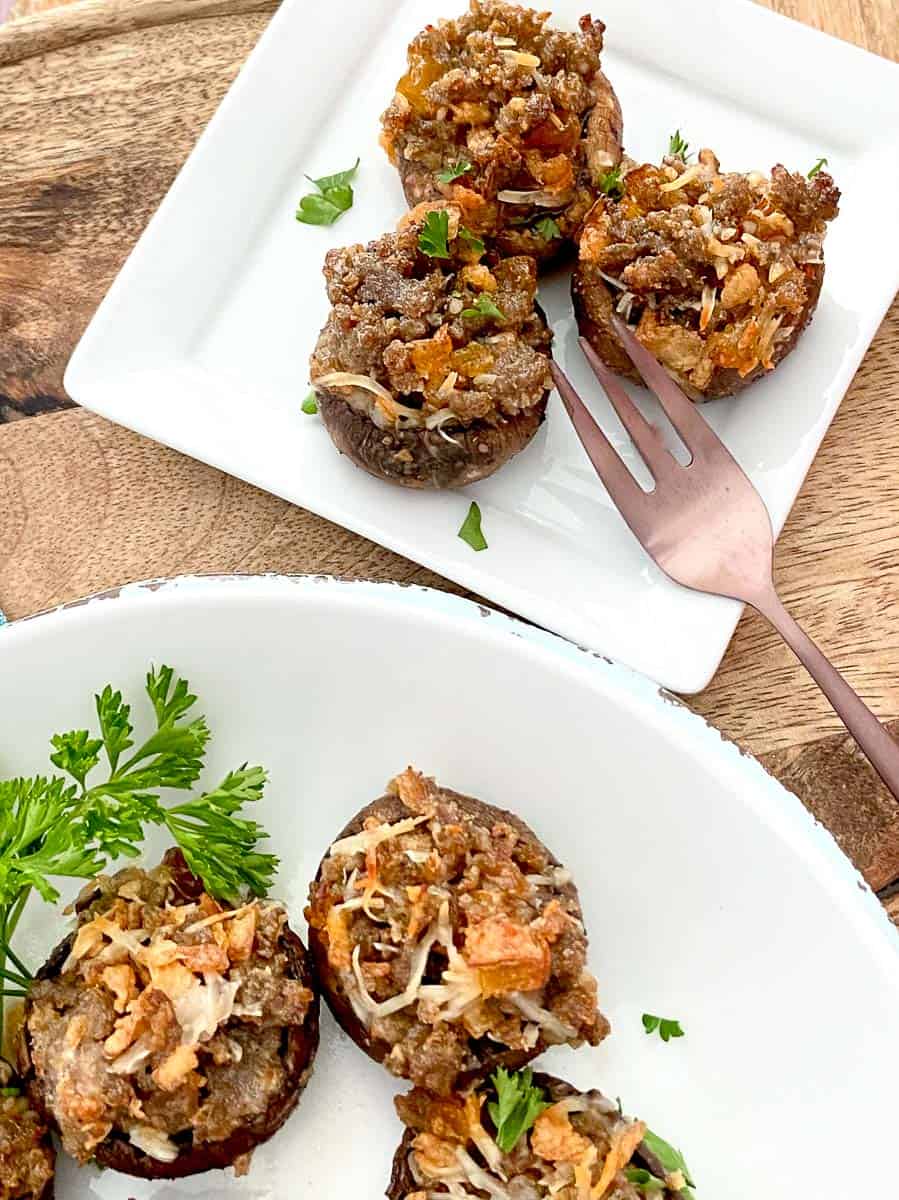 Stuffed Sausage Mushrooms on white plate.