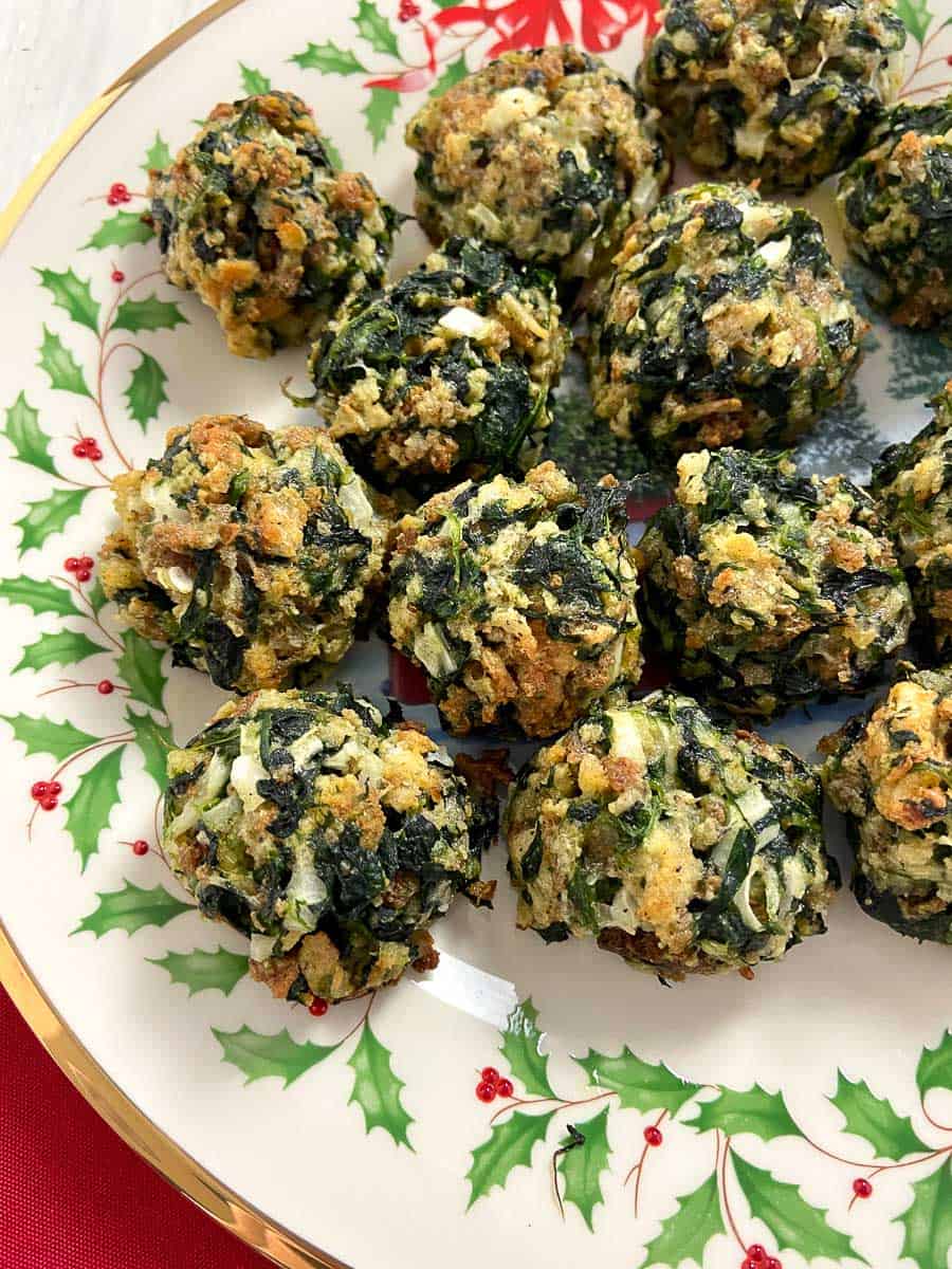 Spinach balls on decorative Christmas plate.