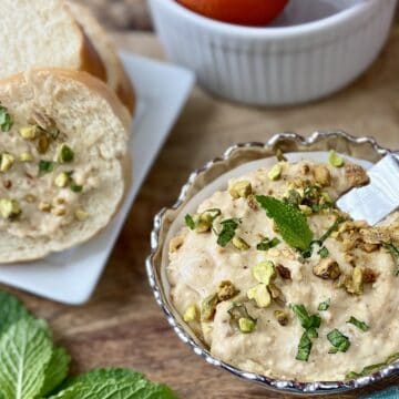 Orange fig spread garnished with pistachios and mint.