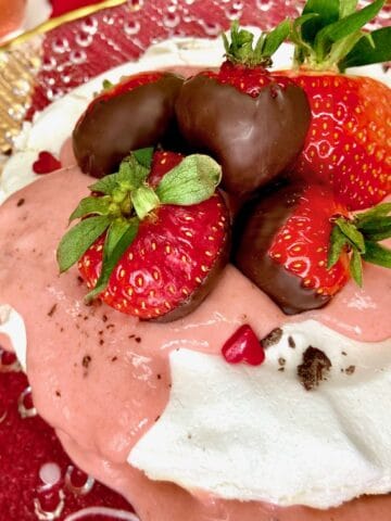 Pavlova with Strawberry curd and chocolate dipped strawberries.