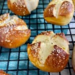 Pretzel balls on black wire rack.