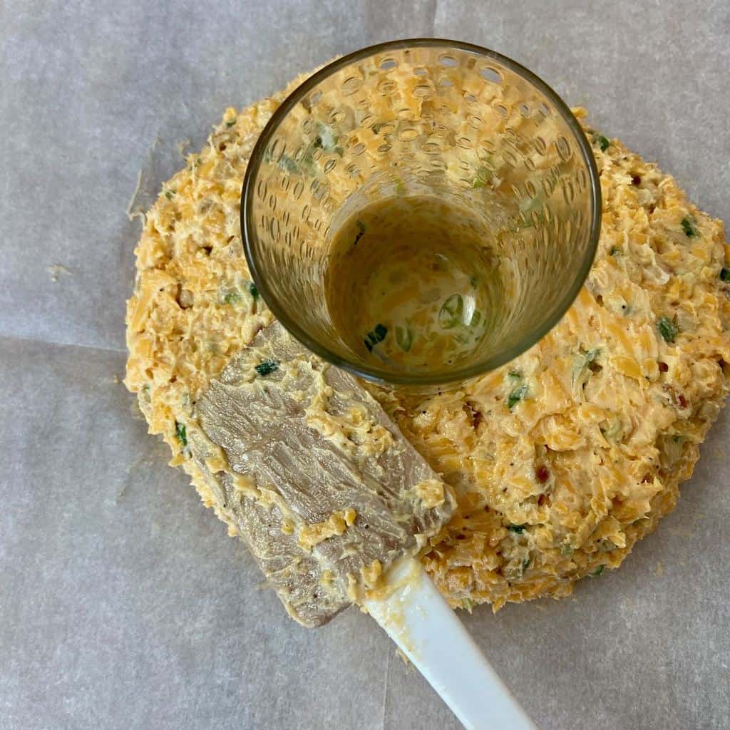 Juice glass in center of cheese mixture.