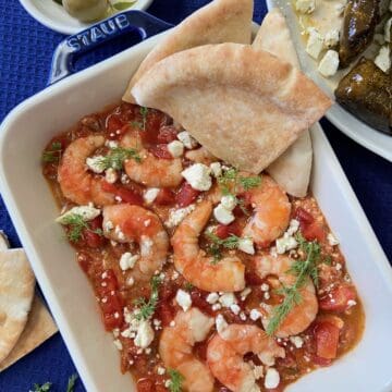 Baked shrimp in white pan.