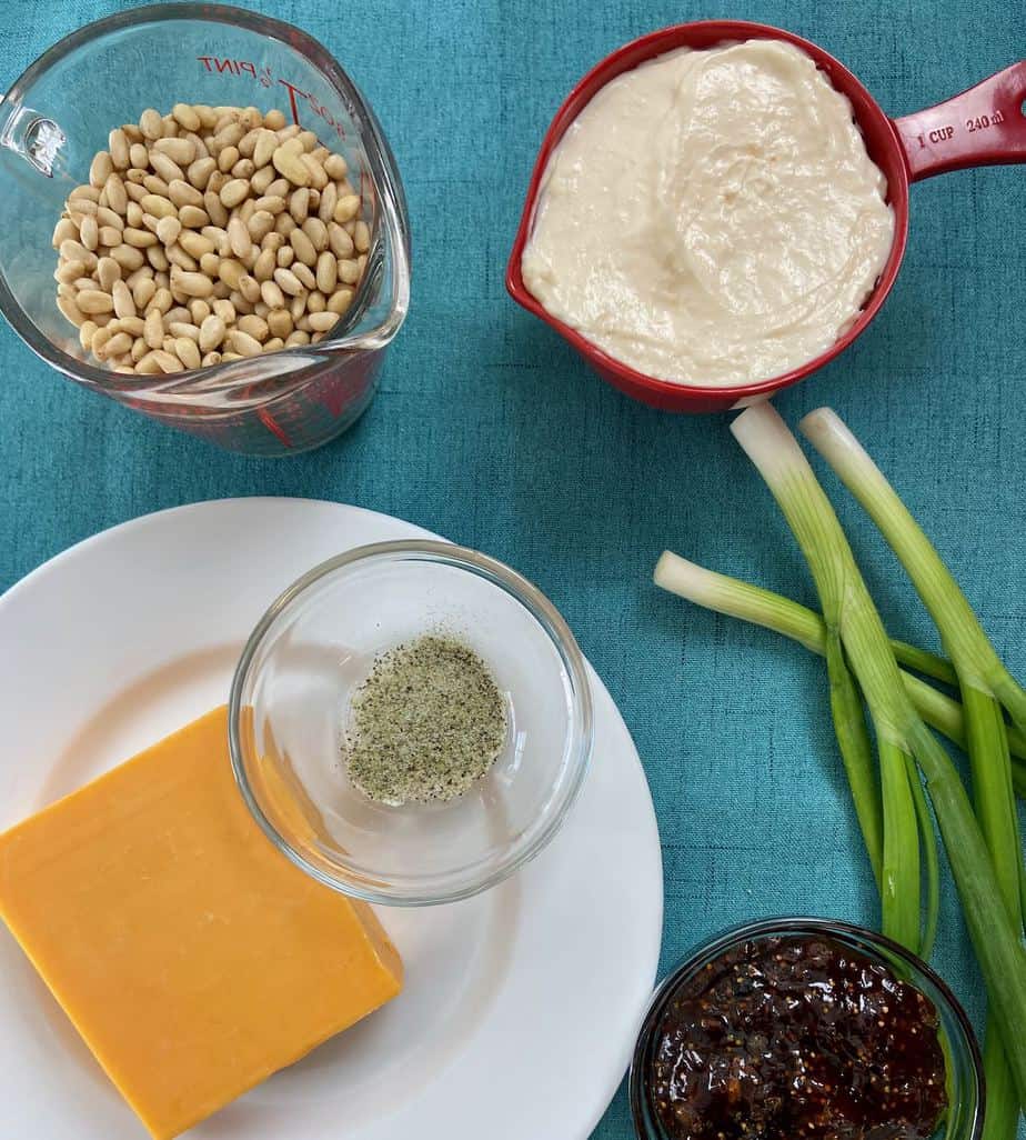 Ingredients on counter with turquoise background.