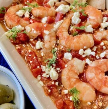 Shrimp Saganaki in white baking dish.