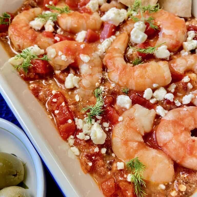 Shrimp Saganaki in white baking dish.