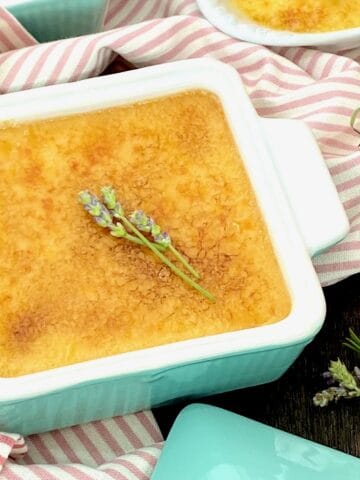 Creme brulee garnished with fresh lavender.