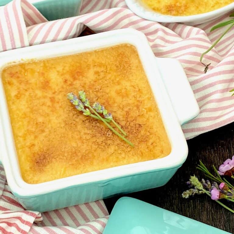 Creme brulee garnished with fresh lavender.
