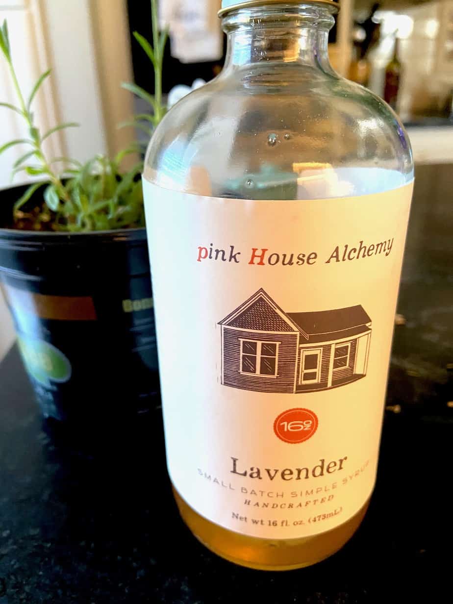 Bottle of Lavender syrup on countertop.