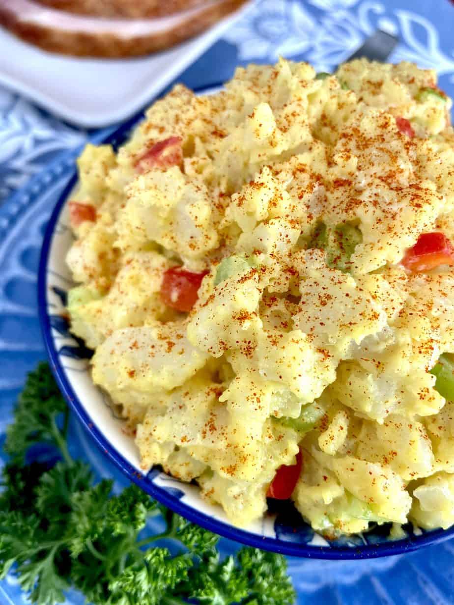 Southern potato salad in decorative blue bowl.