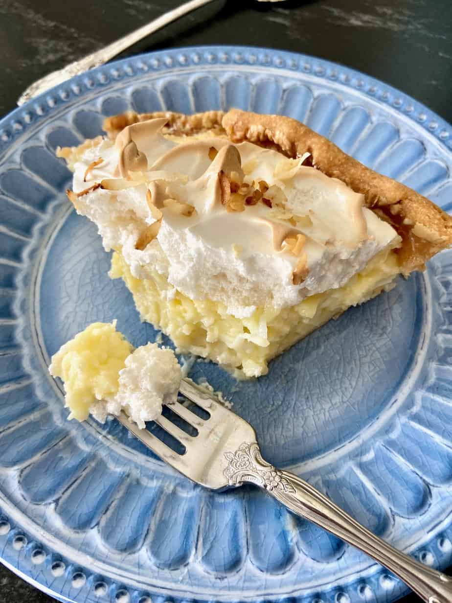 Slice of pie with a bite on fork.