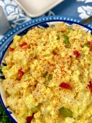 Southern potato salad in decorative blue bowl.