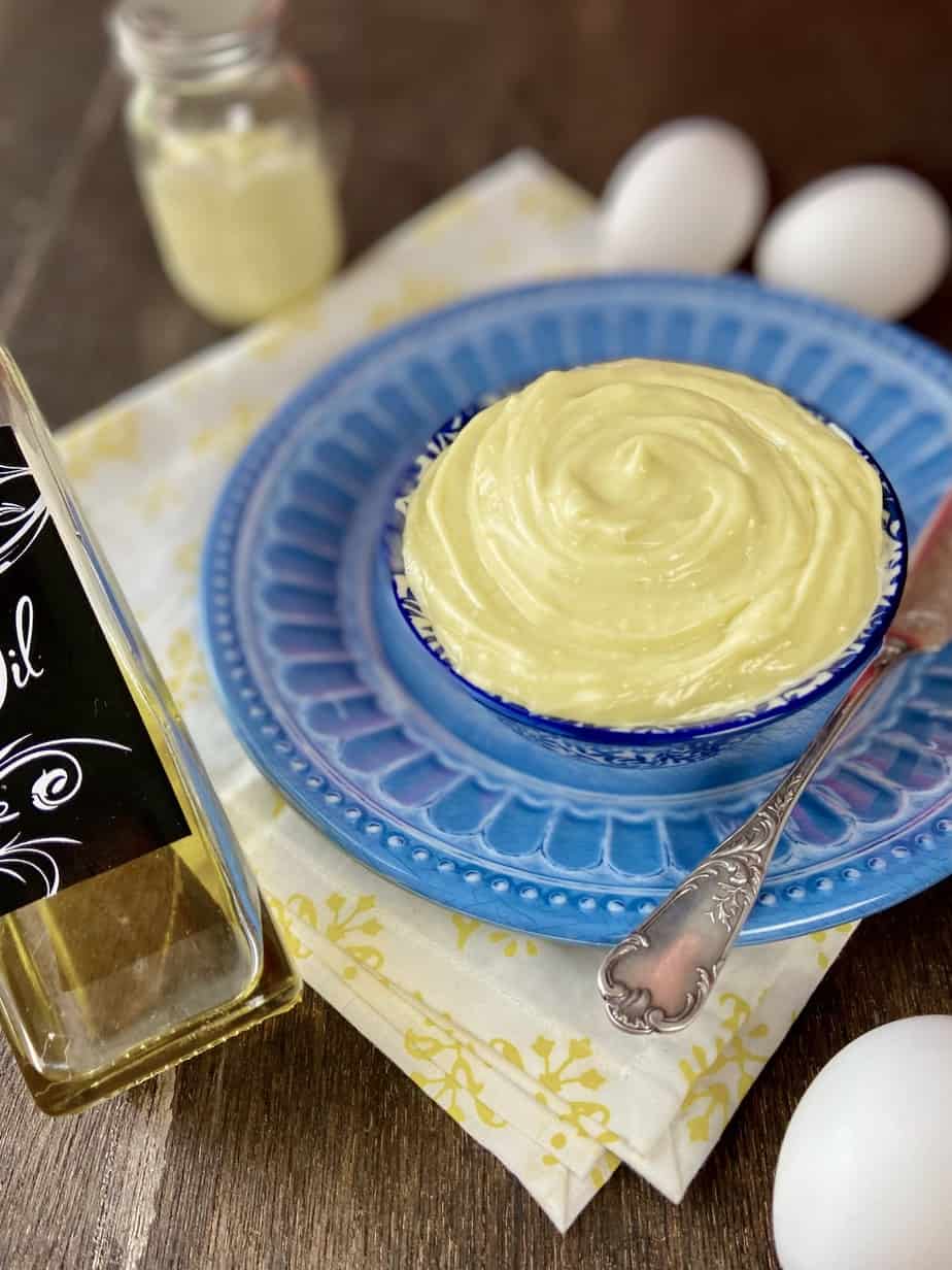 Homemade mayonnaise in blue and white decorative bowl.