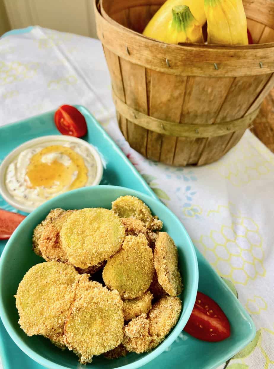 Southern Fried Squash in turquoise bowl with dipping sauce.