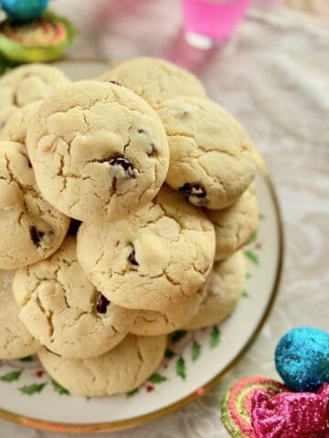 Cookies stacked on decorative plate.