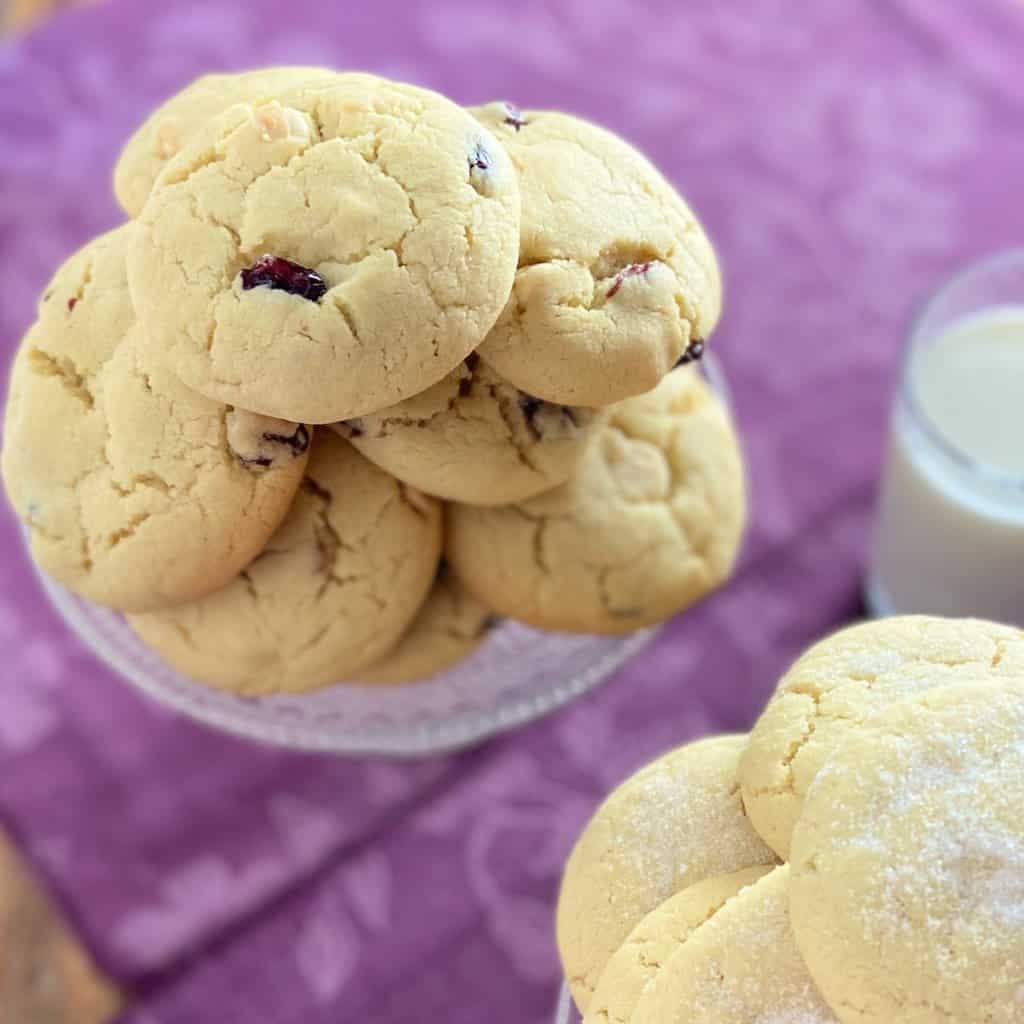 Cookies stacked on glass pedastal.