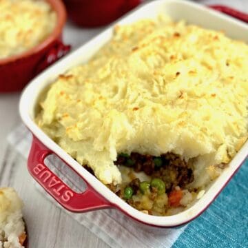 Cottage pie with a scoop out.