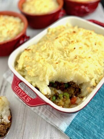 Cottage pie with a scoop out.