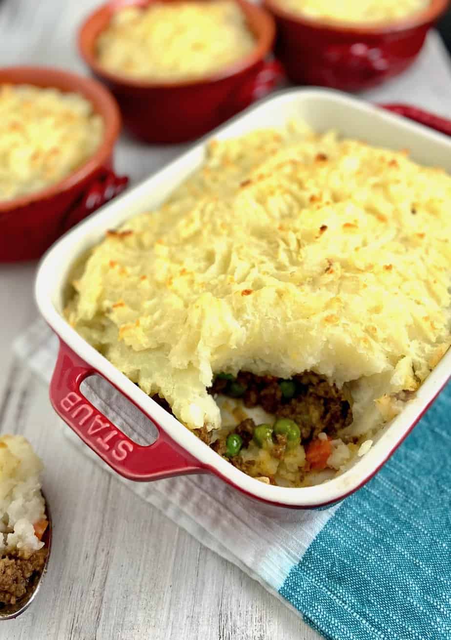 Cottage pie with a scoop out.