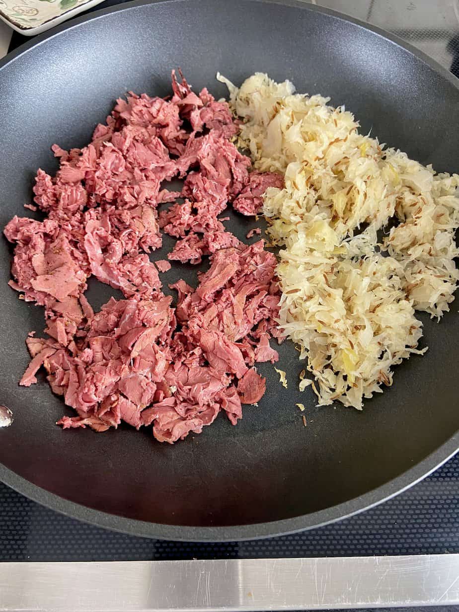 Pastrami and sauerkraut in non stick skillet.