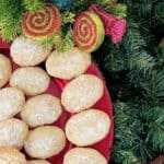 Italian almond cookies on red serving platter.