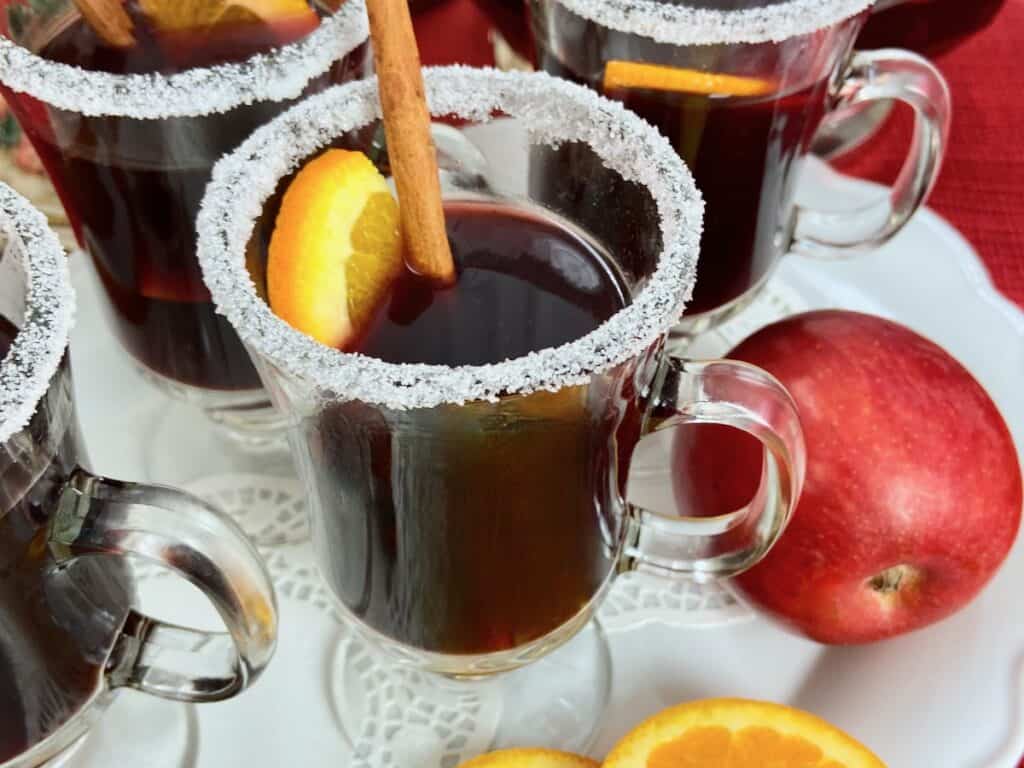 Close up image of mulled wine in glass mug.