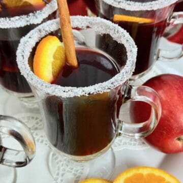 Close up image of mulled wine in glass mug.