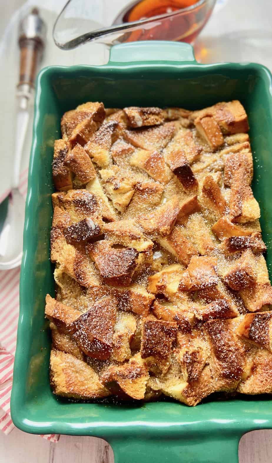 Casserole just out of the oven in green baking dish.