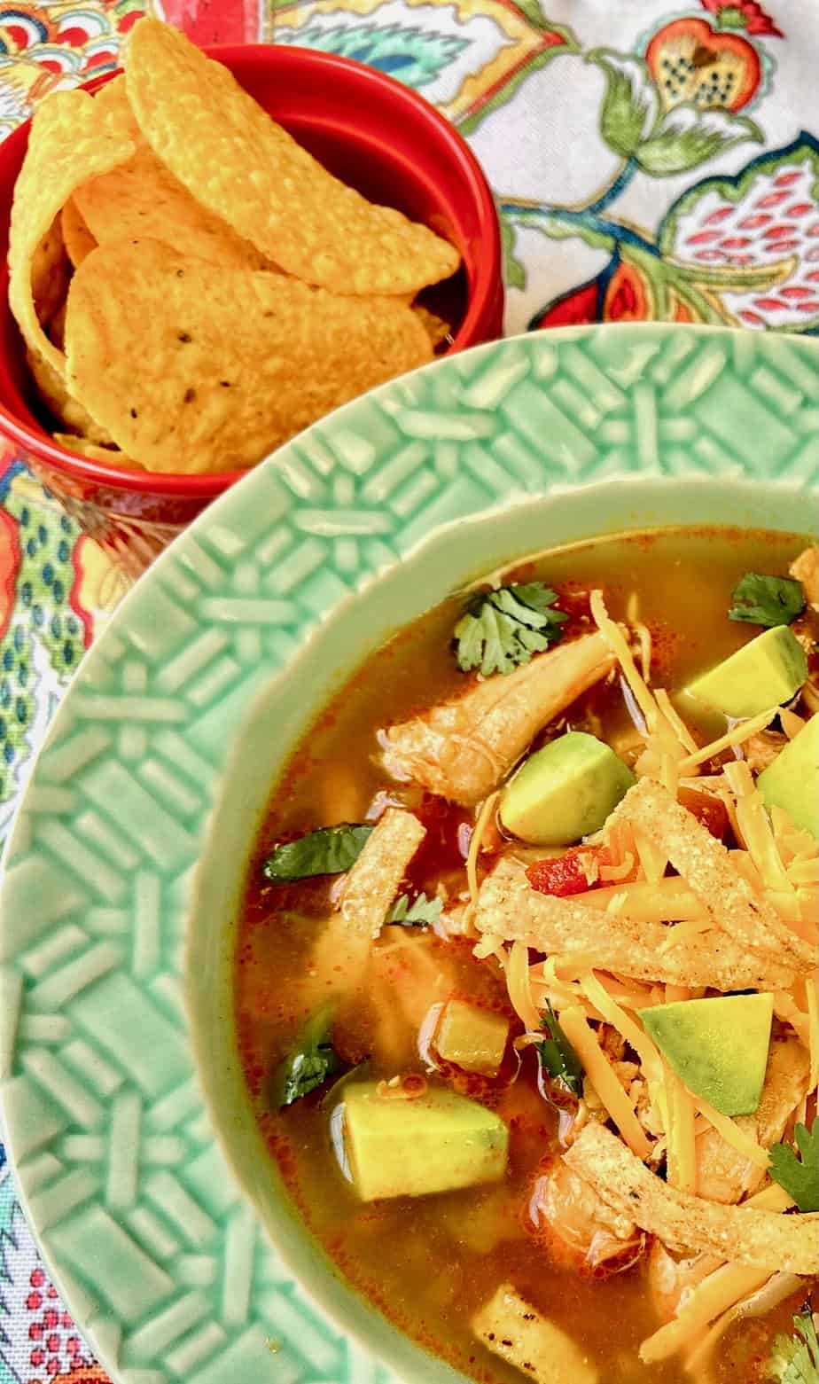 Tortilla soup in turquoise bowl.