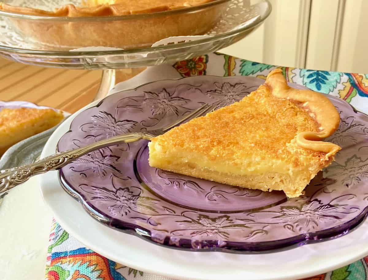 Buttermilk pie on purple plate.