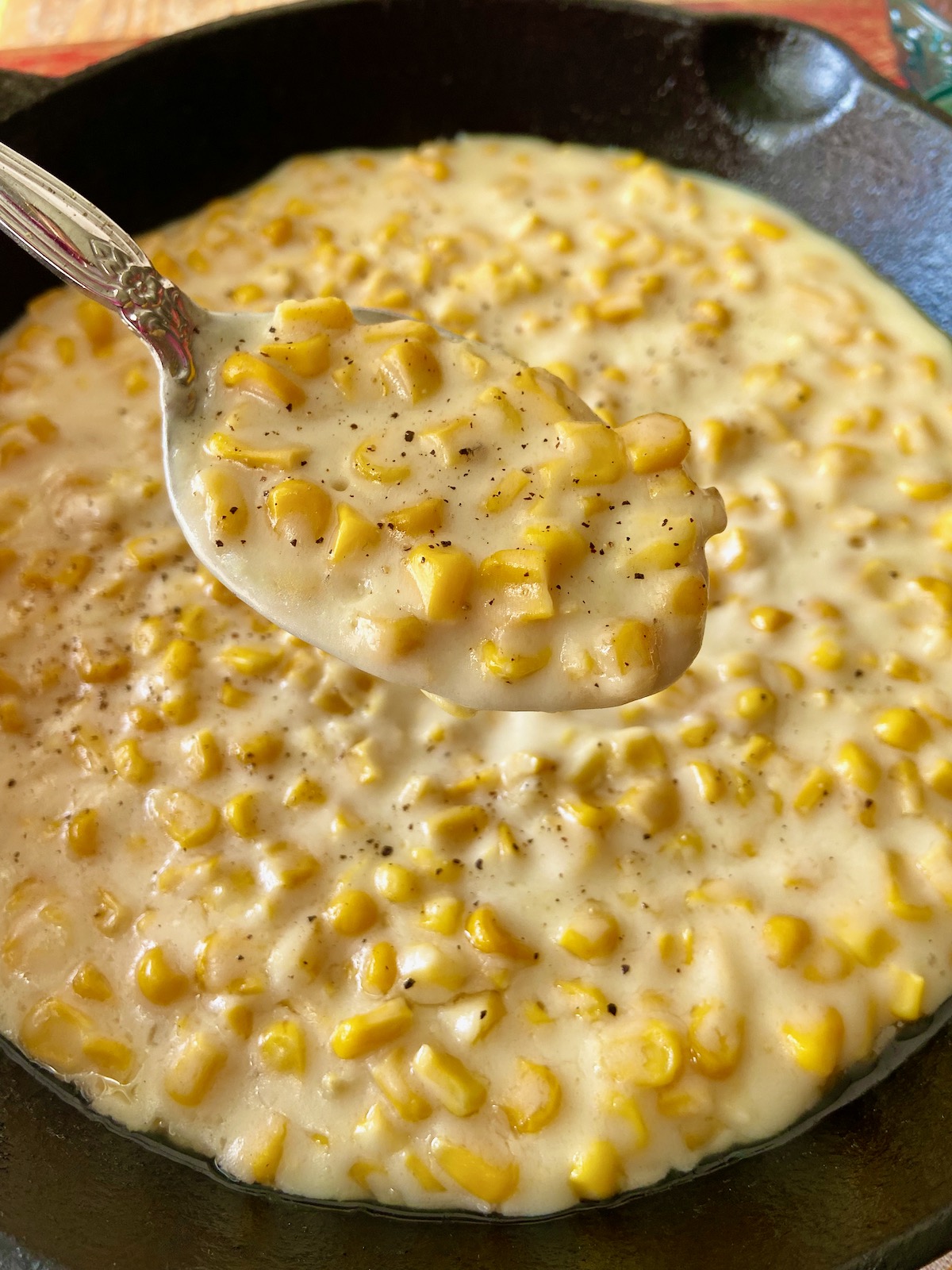 Creamed corn in cast iron skillet.