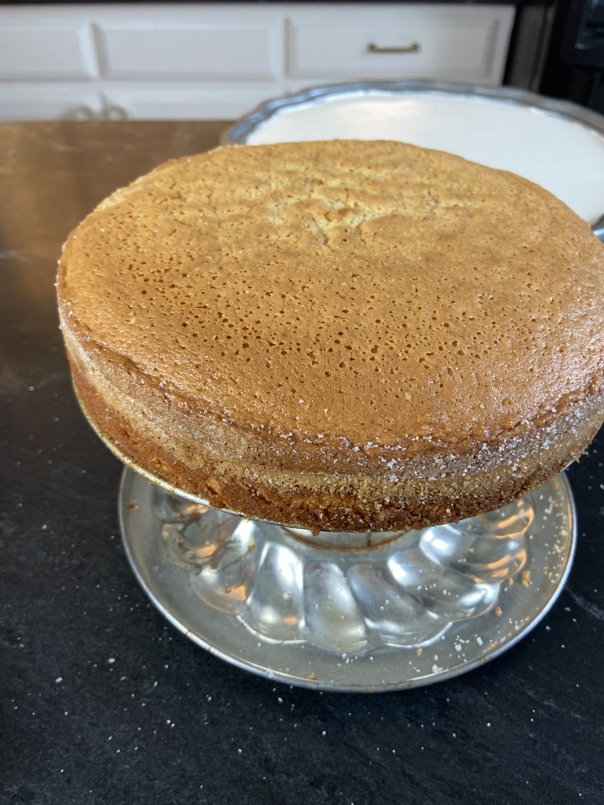 Olive oil cake on pedastal.