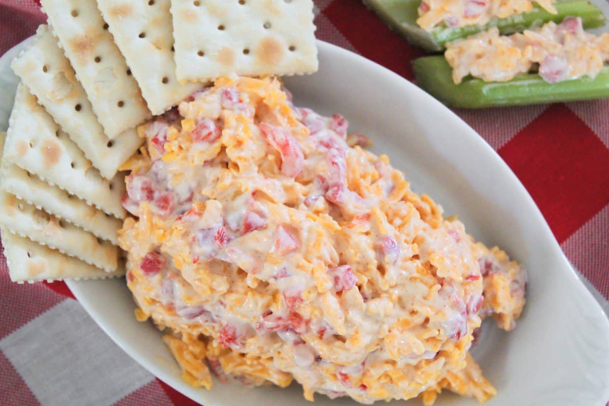 Pimento cheese without cream cheese in white oval serving bowl.