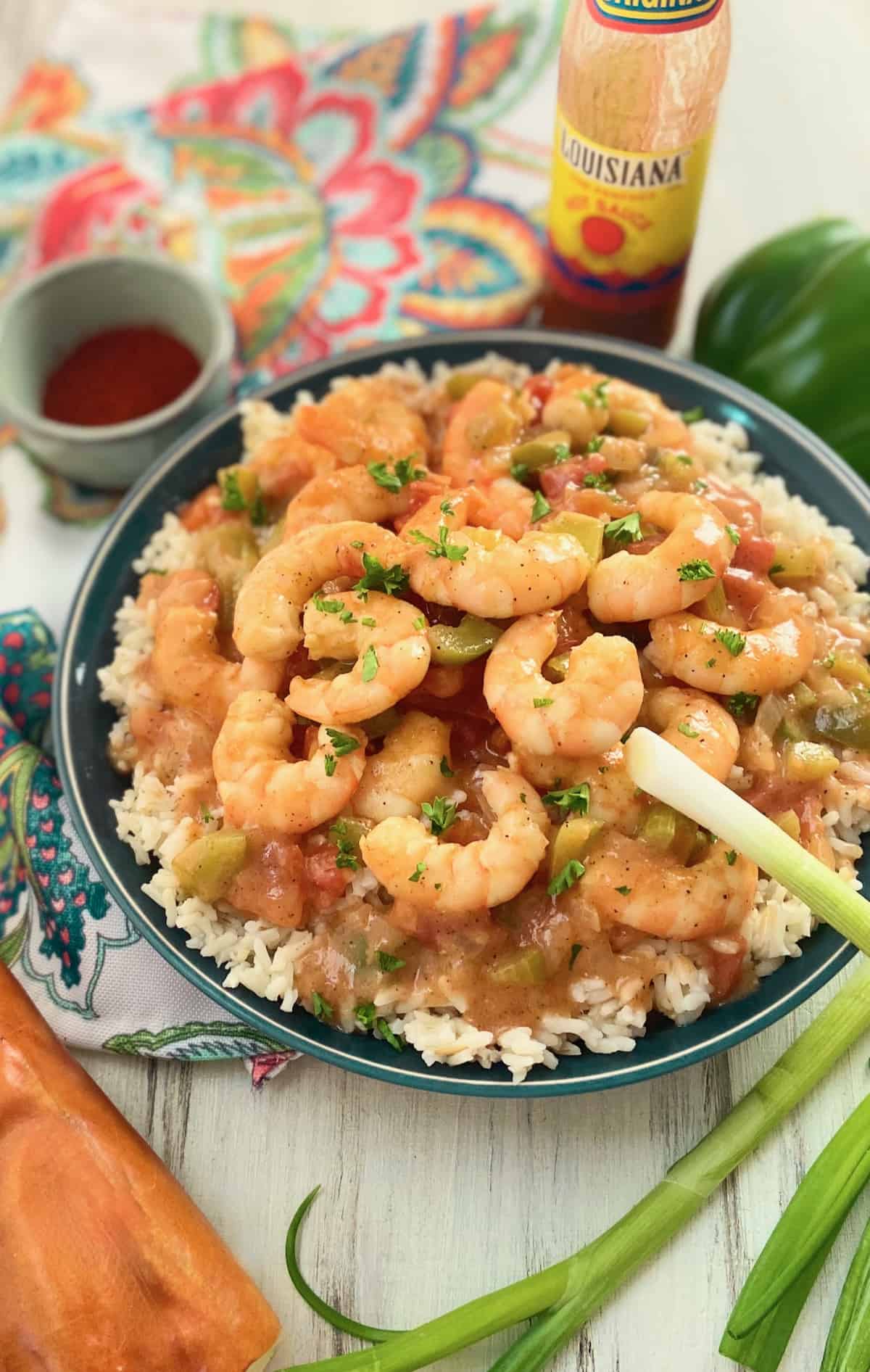 Shrimp Etoufee with rice in a blue bowl.