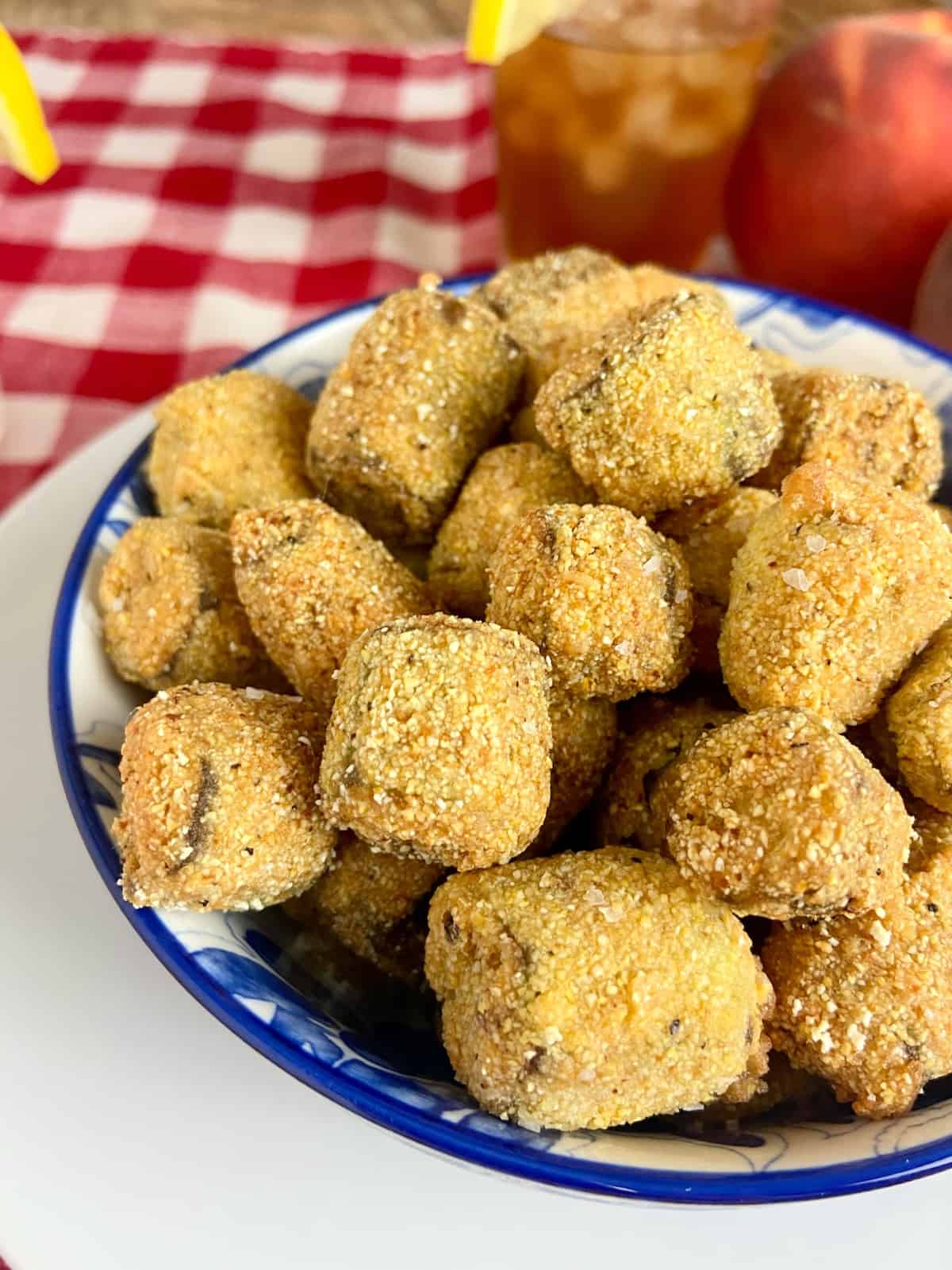 Fried okra in decorative blue bowl.